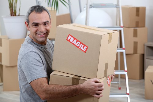 Professional packing team handling household items at Storage Barnet
