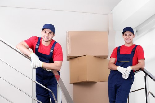 Professional team preparing office equipment for relocation in Storage Barnet